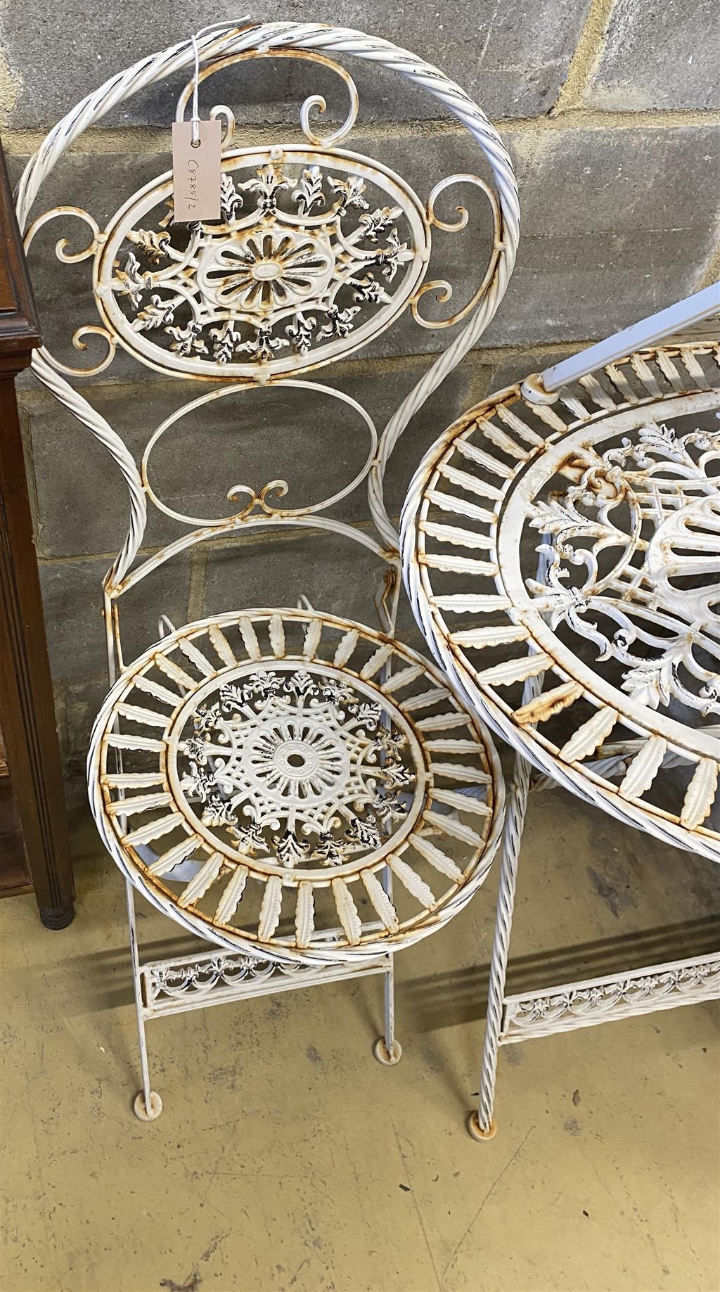 A folding painted aluminium garden table, width 70cm, depth 52cm, height 74cm and two matching chairs